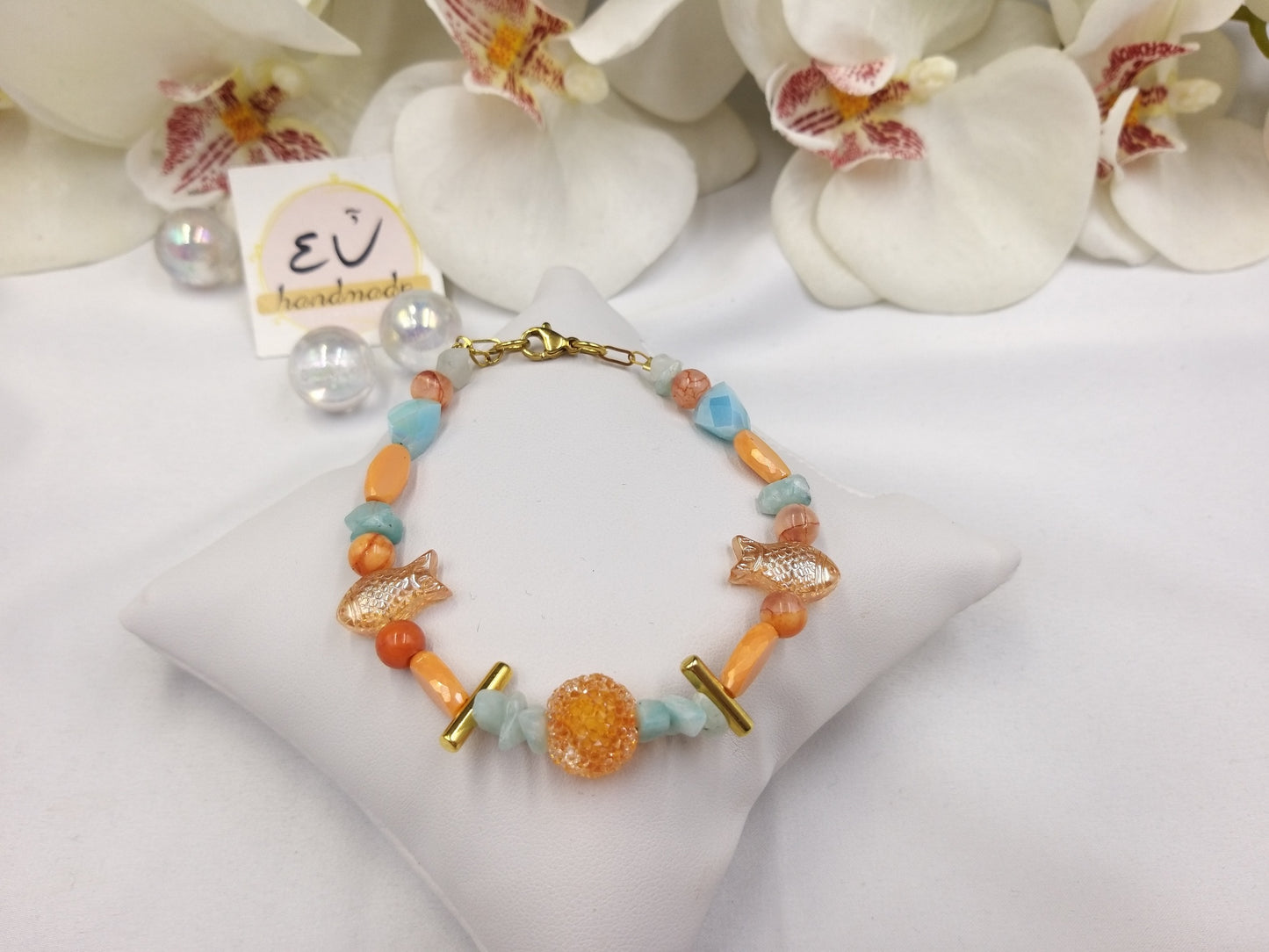 Χειροποίητο γυναικείο βραχιόλι με πορτοκαλί και γαλάζια κρύσταλλα