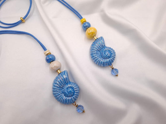 Χειροποίητο κεραμικό κολιέ με baby blue κοχύλι και παστέλ κεραμικές χάντρες